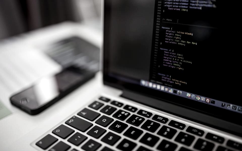Code open in an editor on a laptop screen